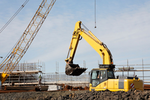 Excavator at building construction